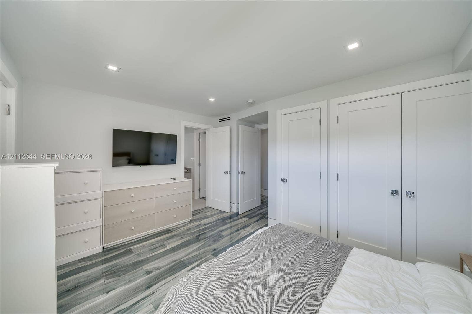 2871 N Ocean Boulevard, #R360, Boca Raton, Boca Raton, FL 33431 Wood-finish flooring with a multi-tonal pattern, recessed ceiling lighting, and double-door reach-in closet featuring shaker-style panels