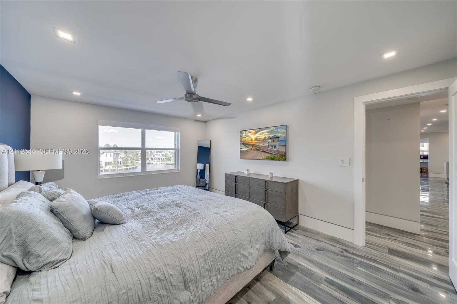 2871 N Ocean Boulevard, #R360, Boca Raton, Boca Raton, FL 33431 Bedroom featuring multi-tonal wood-finish flooring, recessed lighting, a modern ceiling fan, and a dual-pane window