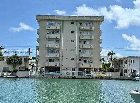 8400 Byron Avenue, #4E, Miami Beach, Miami Beach, FL 33141 Multi-story residential building featuring private balconies, concrete construction, and direct bulkhead access to the waterway