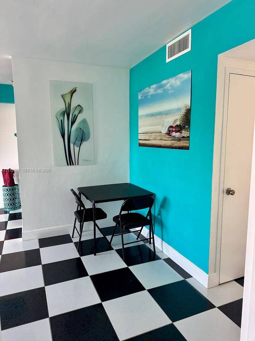 8400 Byron Avenue, #4E, Miami Beach, Miami Beach, FL 33141 High-contrast black and white checkerboard flooring complemented by an accent wall