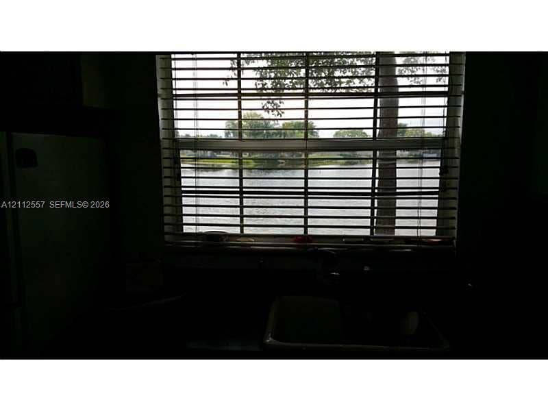 2121 NW 96th Terrace, #14J, Pembroke Pines, Pembroke Pines, FL 33024 Single-basin under-mount sink, horizontal slat blinds, and exterior water frontage