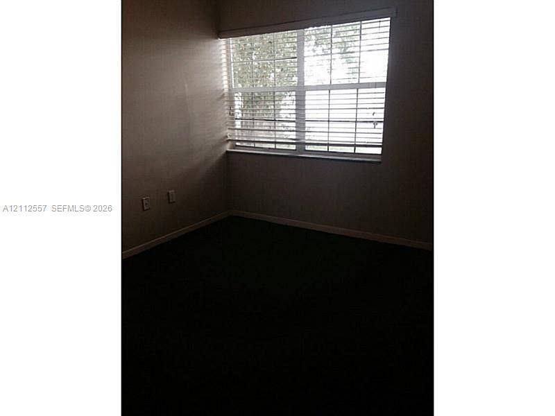 2121 NW 96th Terrace, #14J, Pembroke Pines, Pembroke Pines, FL 33024 Room featuring wall-to-wall carpeting and a multi-pane window with horizontal blinds