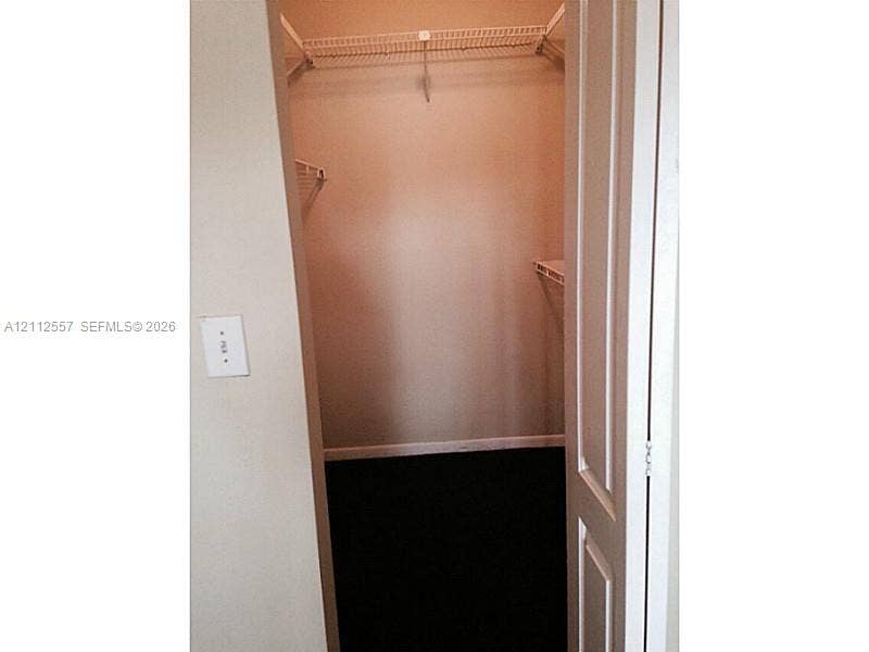 2121 NW 96th Terrace, #14J, Pembroke Pines, Pembroke Pines, FL 33024 Walk-in storage space featuring white wire shelving and dark flooring