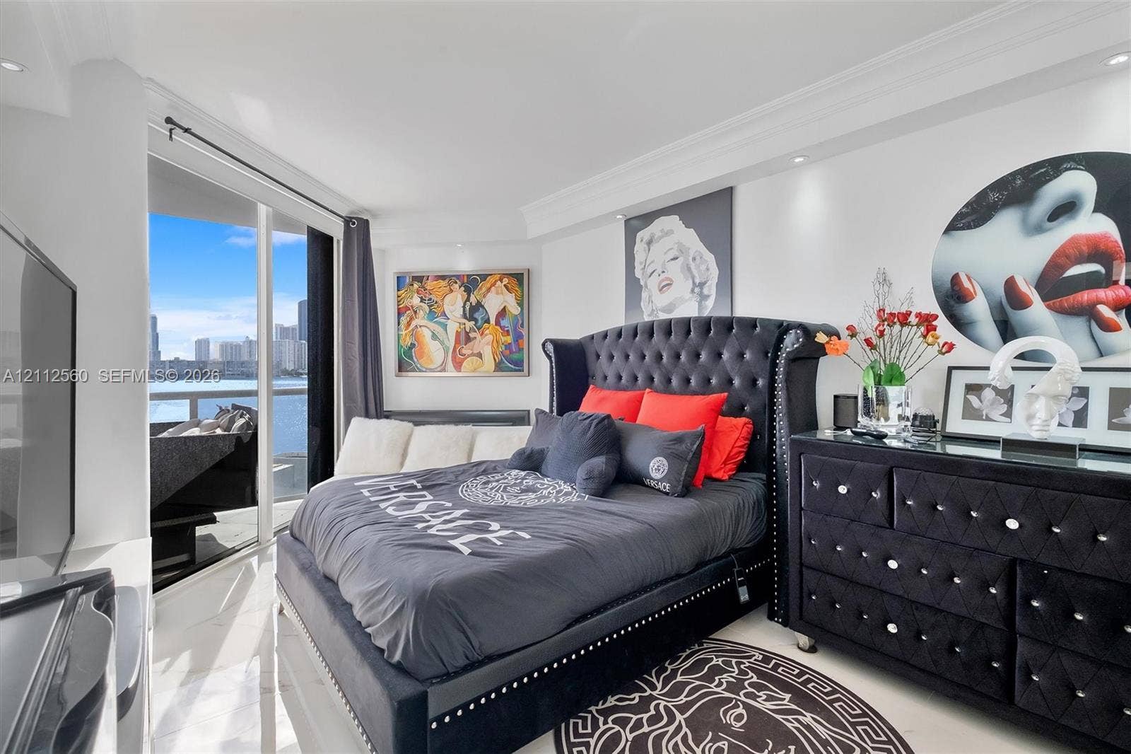 4000 Island Boulevard, #701, Aventura, FL 33160 Floor-to-ceiling glass paneling, polished stone flooring, crown molding, and recessed lighting throughout