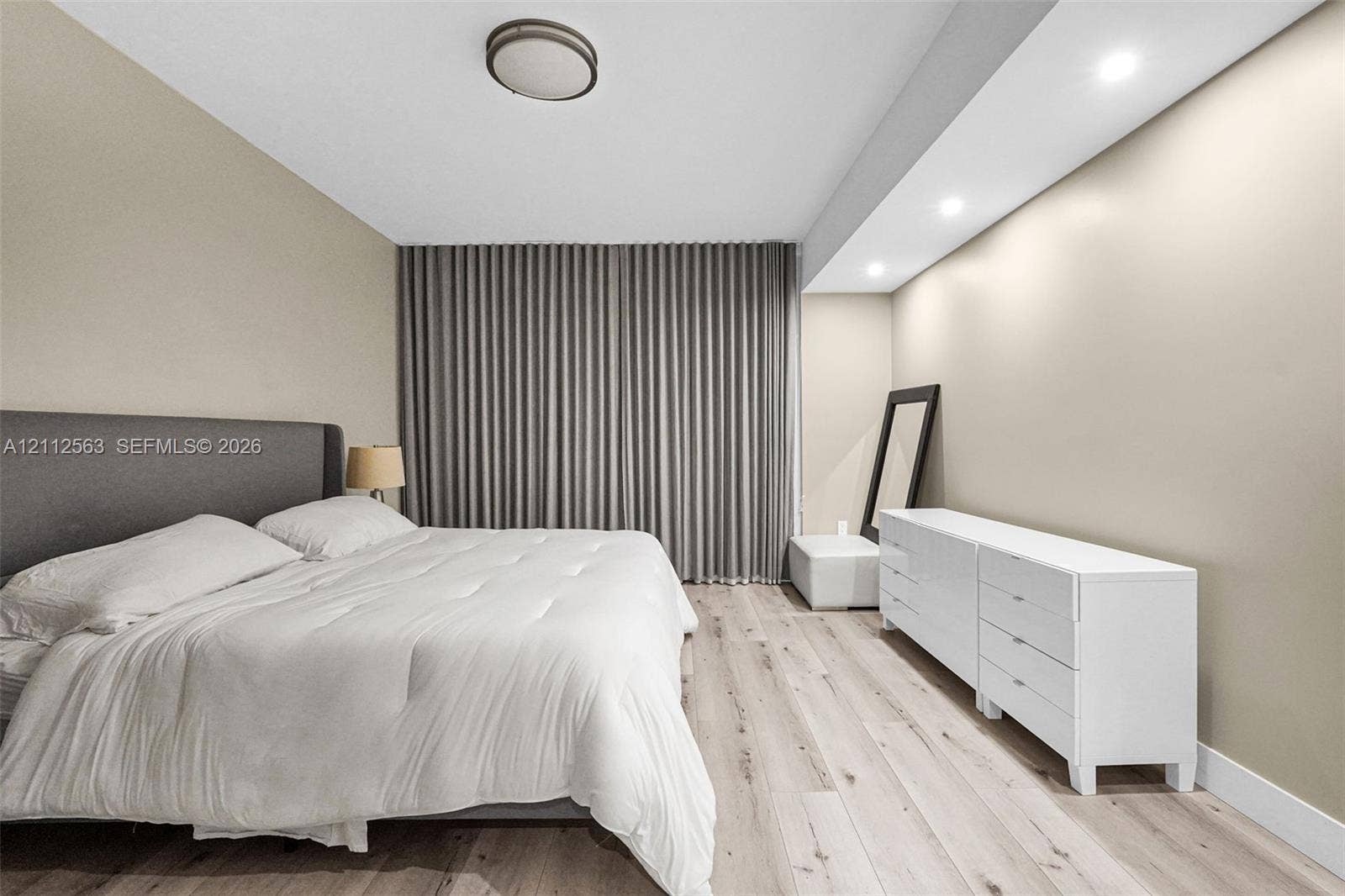 3330 NE 190th Street, #2016, Aventura, FL 33180 Light-toned wood-finish flooring, recessed ceiling lighting, and floor-to-ceiling drapery