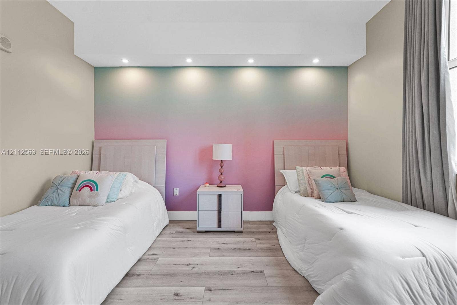 3330 NE 190th Street, #2016, Aventura, FL 33180 Wood-finish flooring, recessed ceiling lighting, and a focal wall with a gradient finish