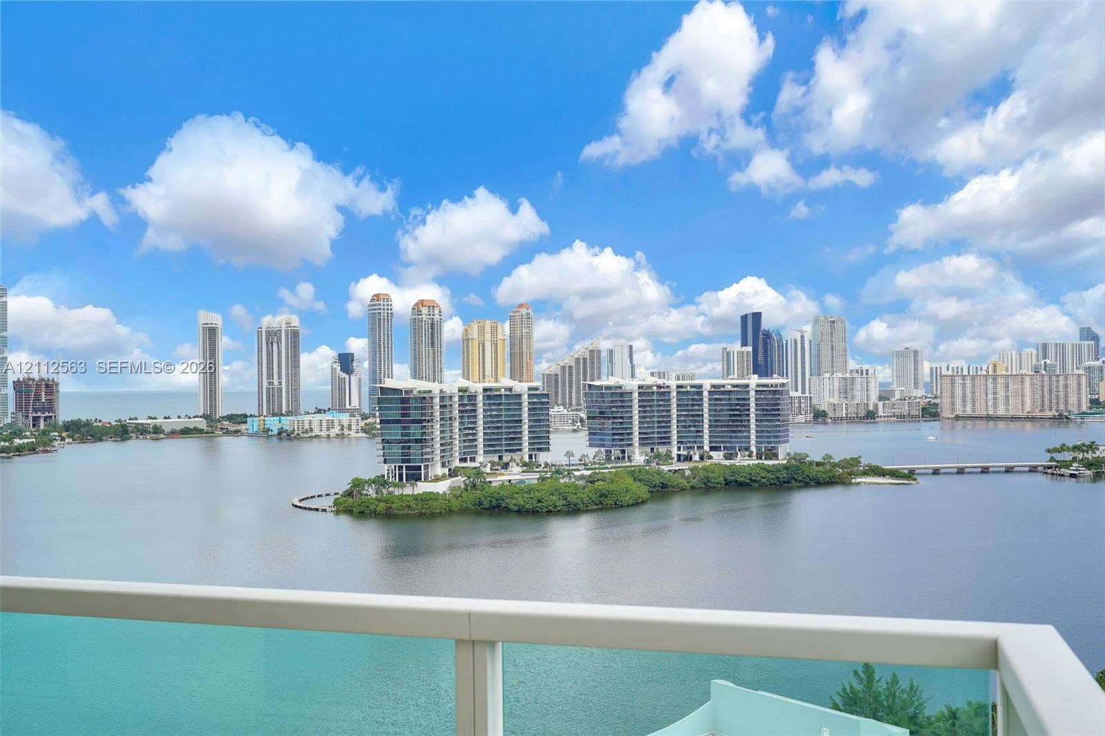 3330 NE 190th Street, #2016, Aventura, FL 33180 Balcony featuring a glass panel railing and panoramic waterfront and city skyline scenery
