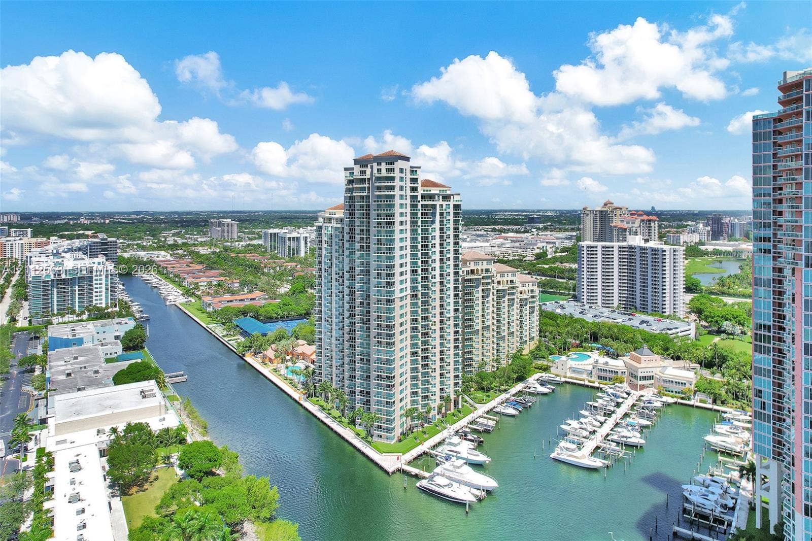 3330 NE 190th Street, #2016, Aventura, FL 33180 High-rise residential tower featuring private balconies, integrated deep-water marina, concrete dockage, and extensive waterfront footage