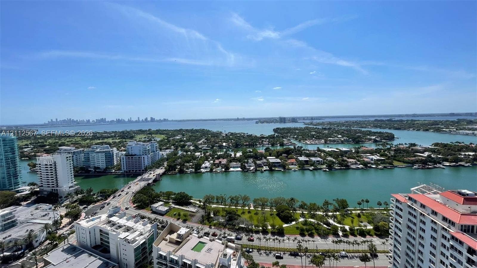 6365 Collins Avenue, #3208, Miami Beach, Miami Beach, FL 33141 Elevated perspective featuring expansive water frontage, bridges, cityscape skyline, and surrounding coastal landscape