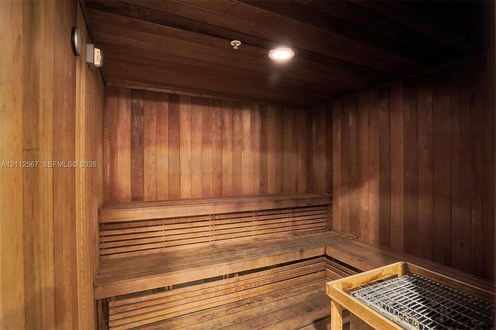 6365 Collins Avenue, #3208, Miami Beach, Miami Beach, FL 33141 Sauna featuring natural wood paneling, multi-level slatted benches, and a dedicated heating unit