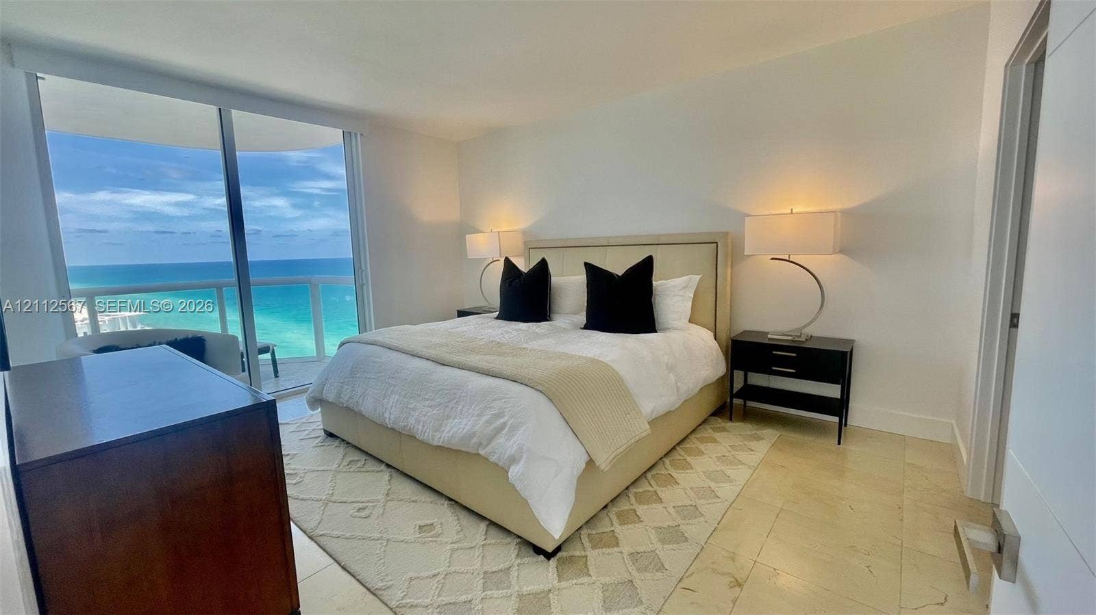 6365 Collins Avenue, #3208, Miami Beach, Miami Beach, FL 33141 Full-height glass sliding doors, polished stone flooring, and expansive ocean horizon