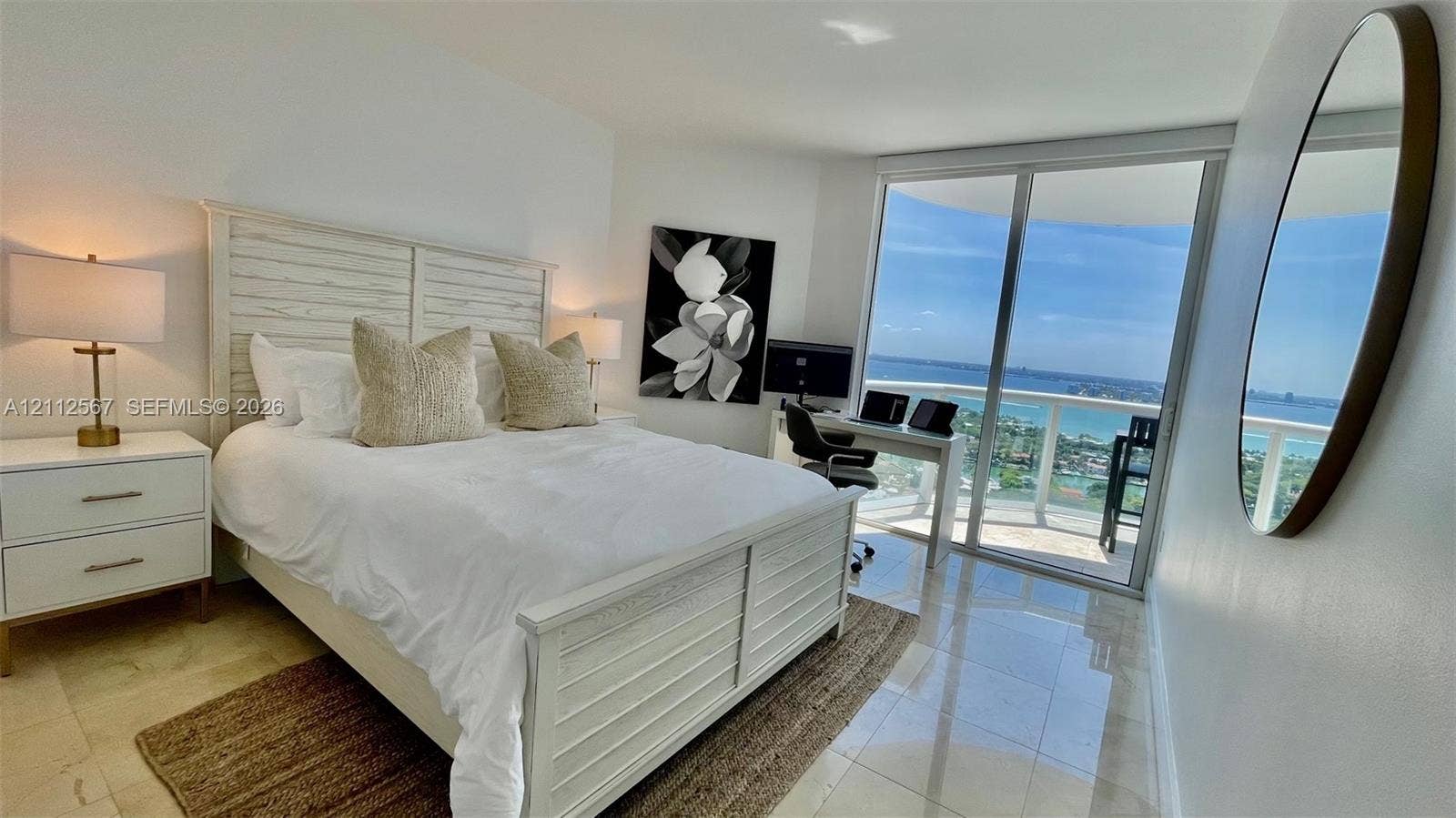 6365 Collins Avenue, #3208, Miami Beach, Miami Beach, FL 33141 Polished stone flooring, floor-to-ceiling sliding glass doors, and a private balcony