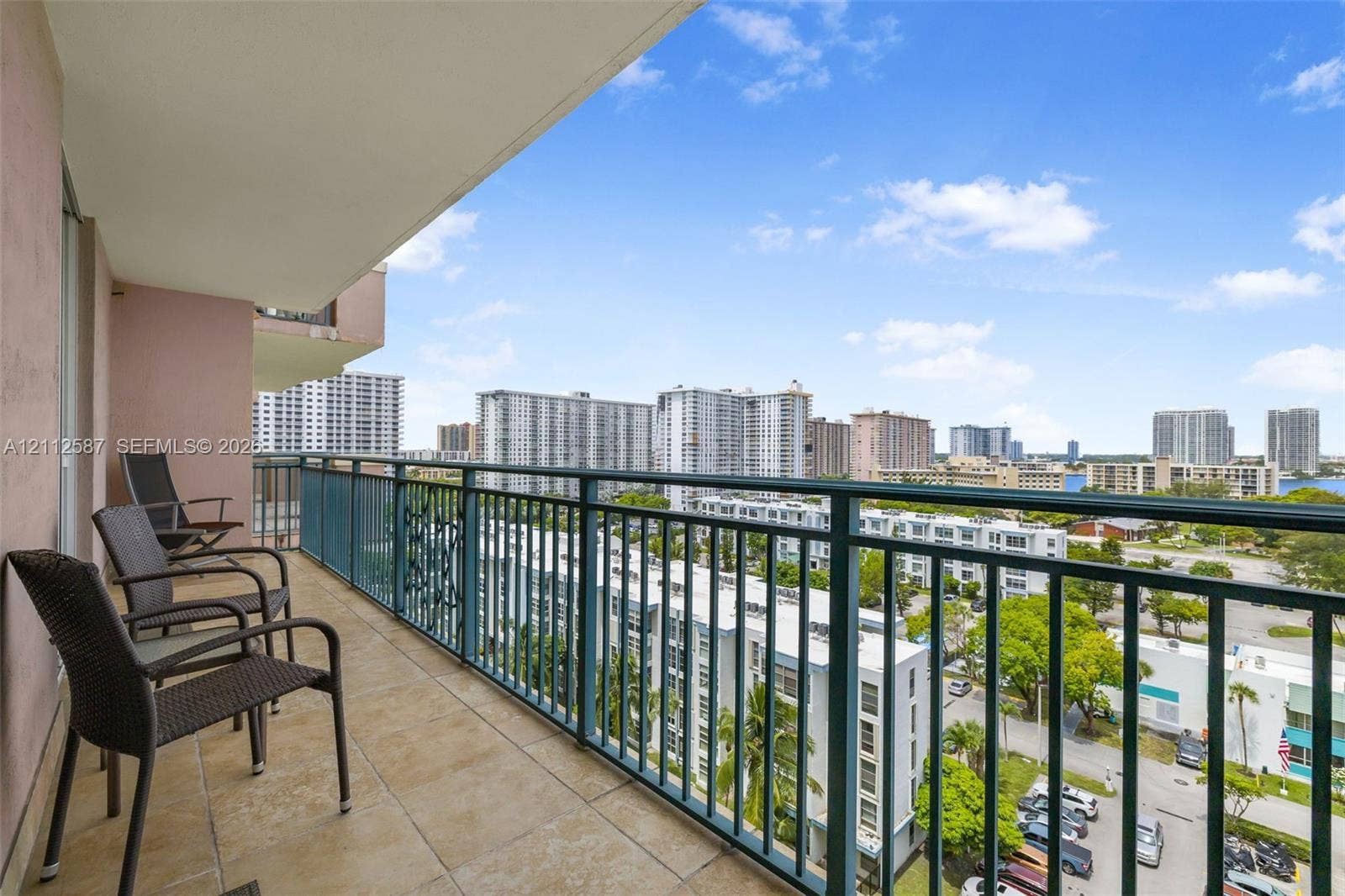 17555 NW Atlantic Boulevard, #1108, Sunny Isles Beach, FL 33160 Covered balcony featuring tile flooring and a metal railing
