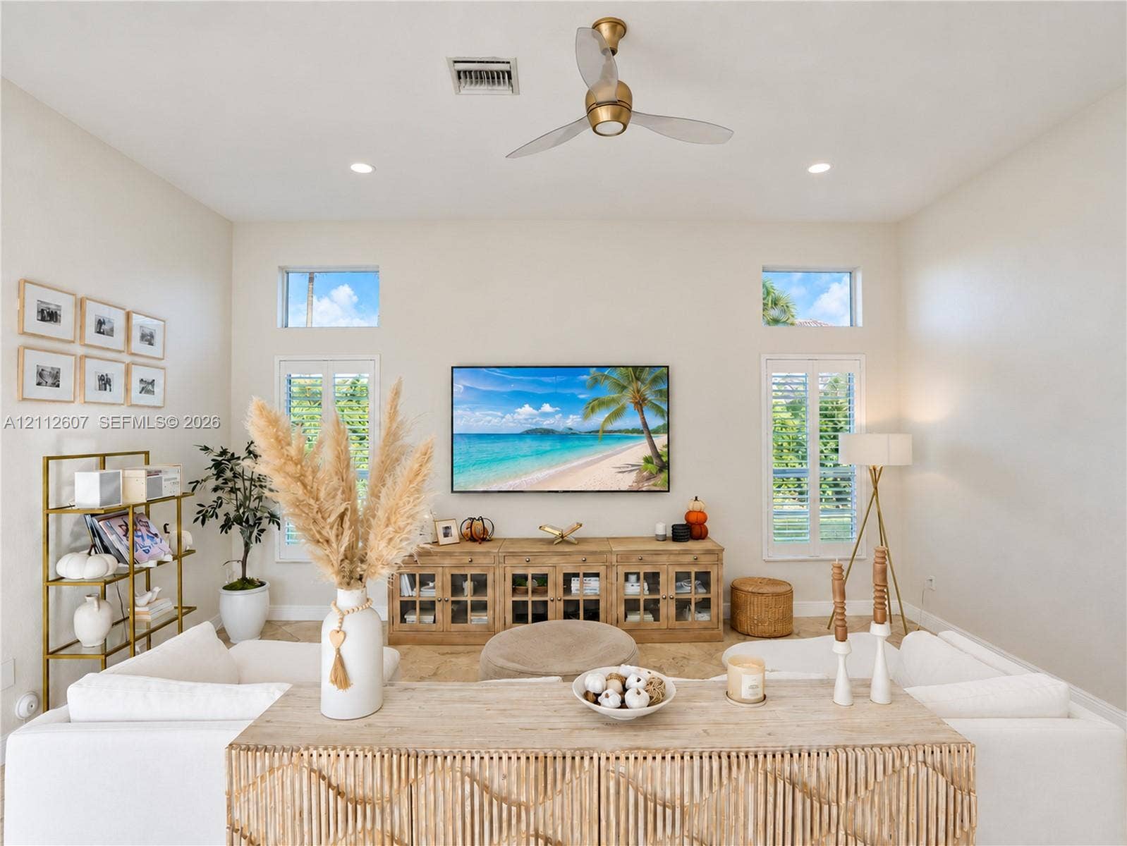 14443 S Jockey Circle S, Davie, FL 33330 High ceilings featuring a central ceiling fan, neutral wall finishes, recessed lighting, double-hung windows with white shutters, and clerestory windows