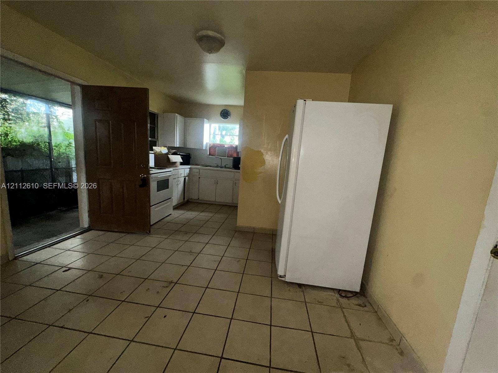 Hialeah, FL 33013 Kitchen featuring ceramic tile flooring, white cabinetry, and a freestanding white range