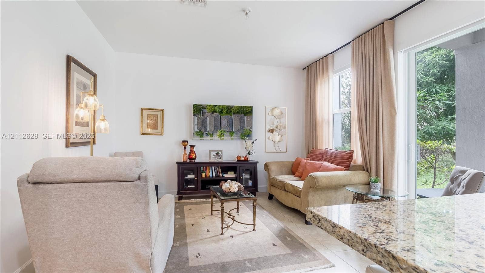 4445 NW 48th Terrace, Tamarac, Tamarac, FL 33319 This light-filled living room off the kitchen offers a sophisticated yet cozy space for daily relaxation, casual gatherings, and effortless comfort- all furniture is included.