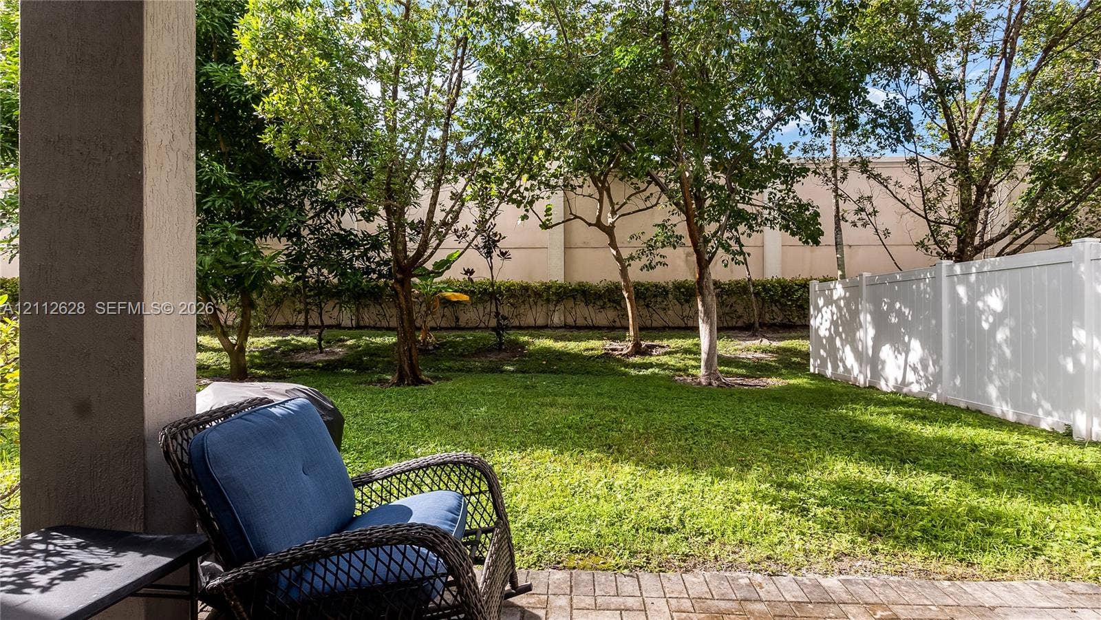 4445 NW 48th Terrace, Tamarac, Tamarac, FL 33319 A charming covered patio extending your living space outdoors, ideal for relaxed evenings, weekend grilling, or effortless indooroutdoor entertaining.