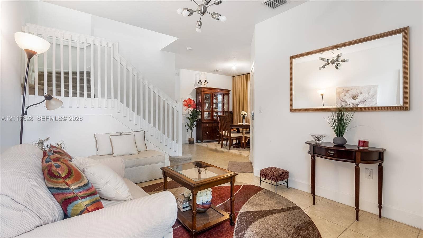 4445 NW 48th Terrace, Tamarac, Tamarac, FL 33319 A stunning formal sitting room at the entrance creates a warm, luxurious first impression, offering a serene, upscale space reserved for your most special guests.