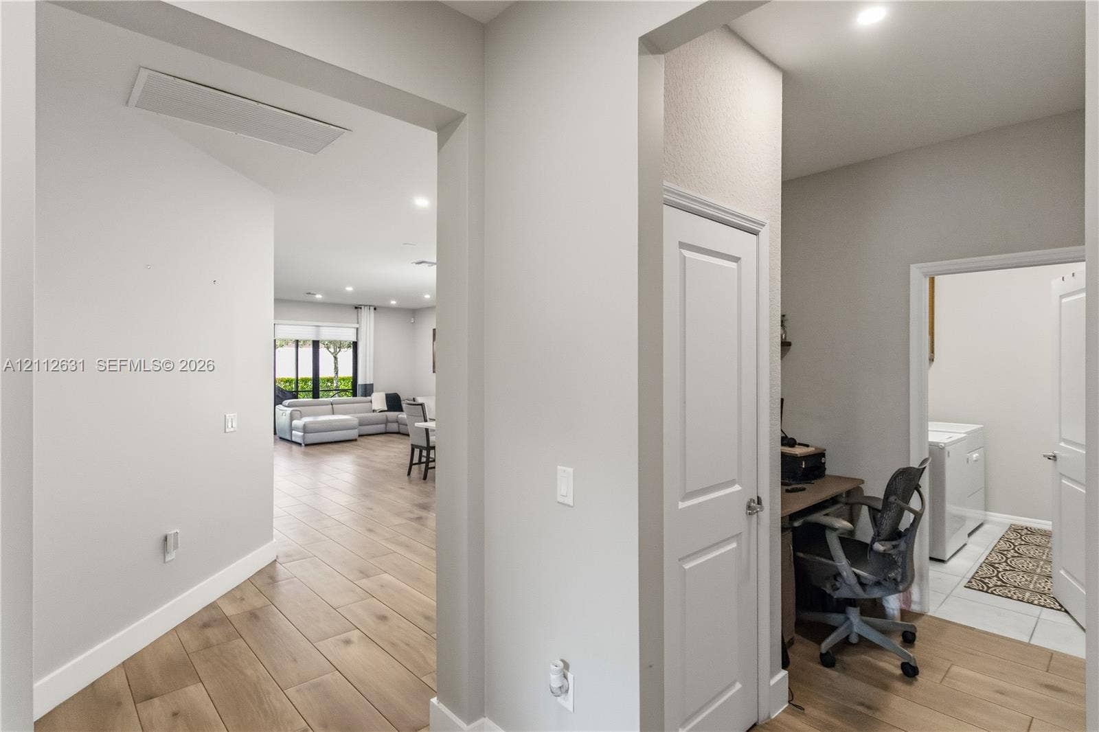 8257 NW 79th Avenue, Tamarac, FL 33321 Interior featuring wood-finish flooring, recessed lighting, and crisp neutral wall paint