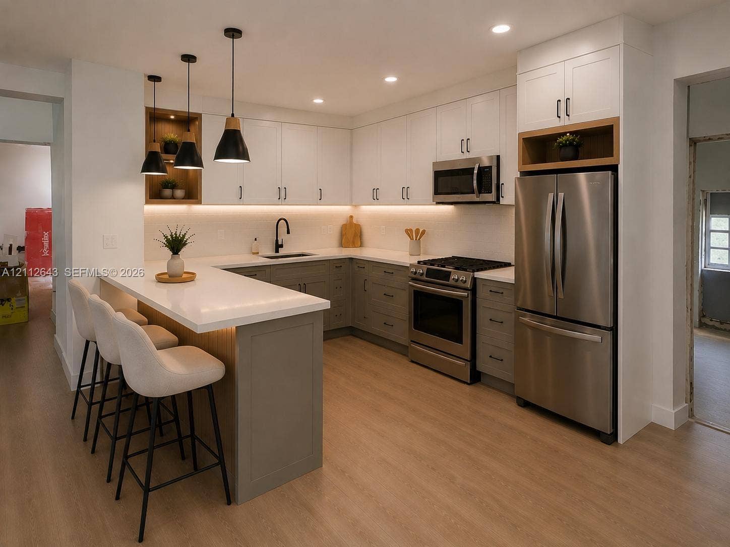 1190 NW 57th Street, Miami, FL 33127 Kitchen featuring two-tone shaker-style cabinetry, quartz countertops, stainless steel appliances, wood-finish flooring, and pendant lighting