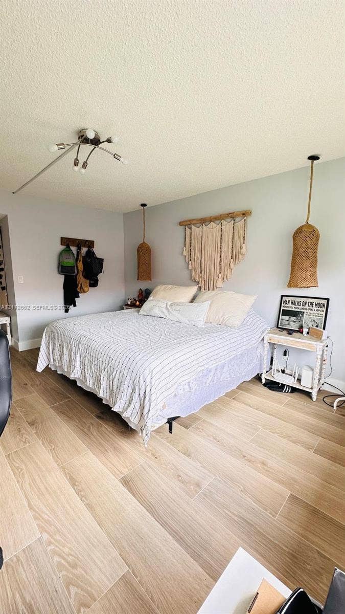 Wood-finish flooring, multi-arm ceiling light fixture, and woven pendant lighting