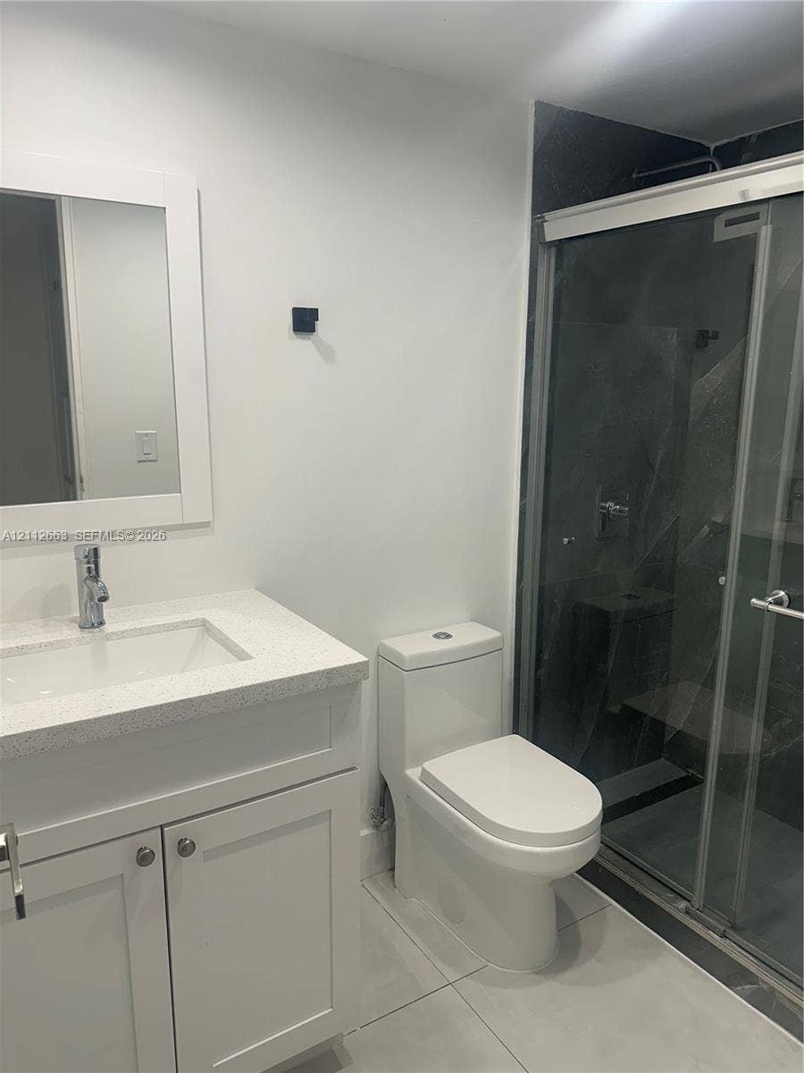 10185 Collins Avenue, #523, Bal Harbour, Bal Harbour, FL 33154 Bathroom featuring a vanity with a white composite countertop, integrated rectangular sink, and polished chrome faucet