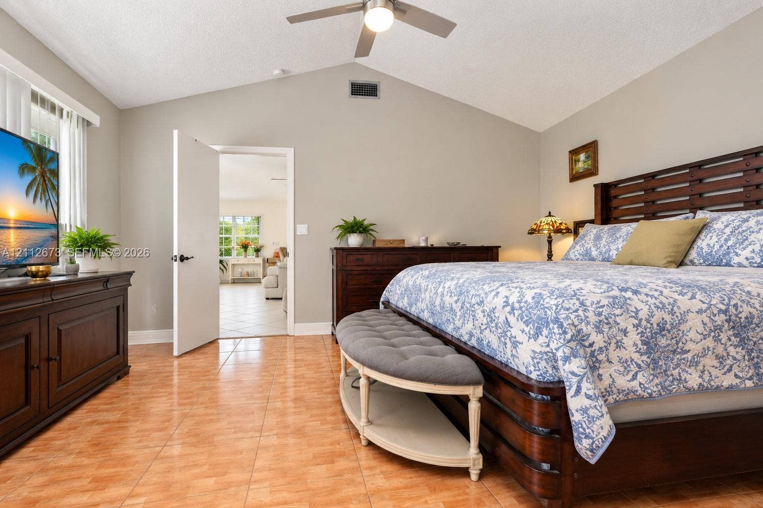 10225 SW 141st Court, #0, Miami, Miami, FL 33186 Vaulted ceiling featuring a central brushed-nickel finish ceiling fan and ceramic tile flooring