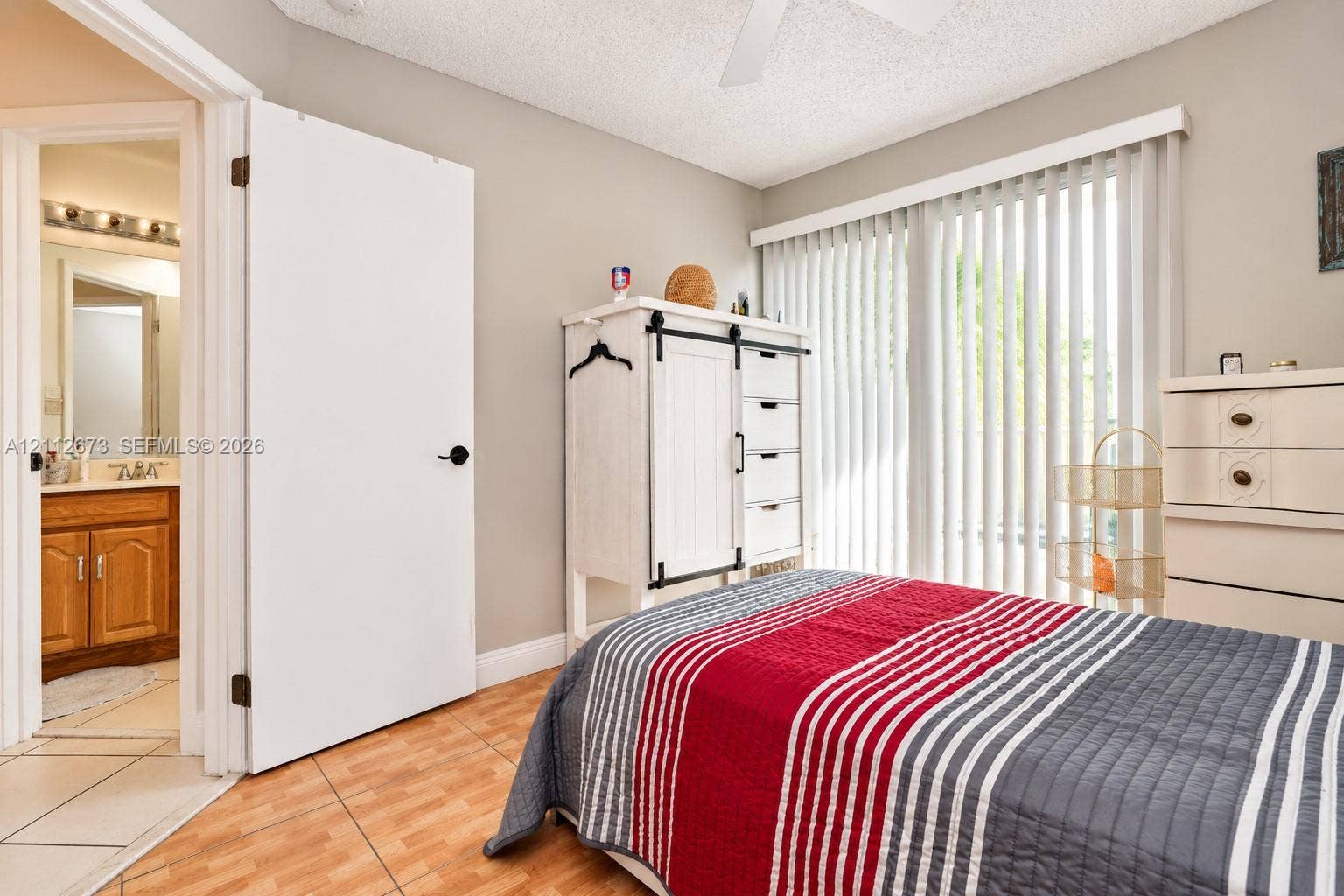 10225 SW 141st Court, #0, Miami, Miami, FL 33186 Room featuring ceramic tile flooring, neutral wall paint, vertical window blinds, and a white ceiling fan
