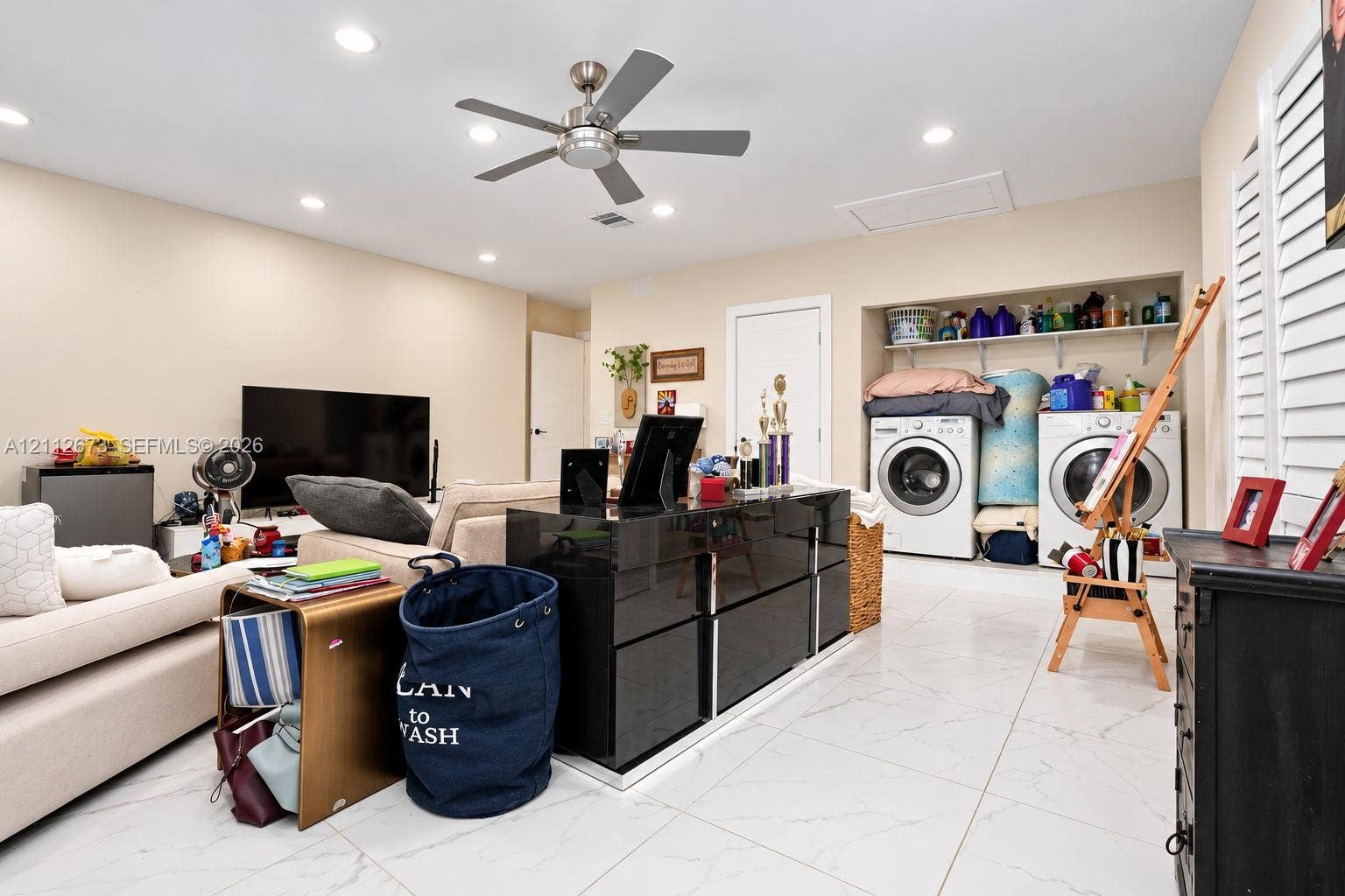 10225 SW 141st Court, #0, Miami, Miami, FL 33186 Large-format white tile flooring, recessed ceiling lighting, brushed metal ceiling fan, and built-in laundry area with overhead shelving