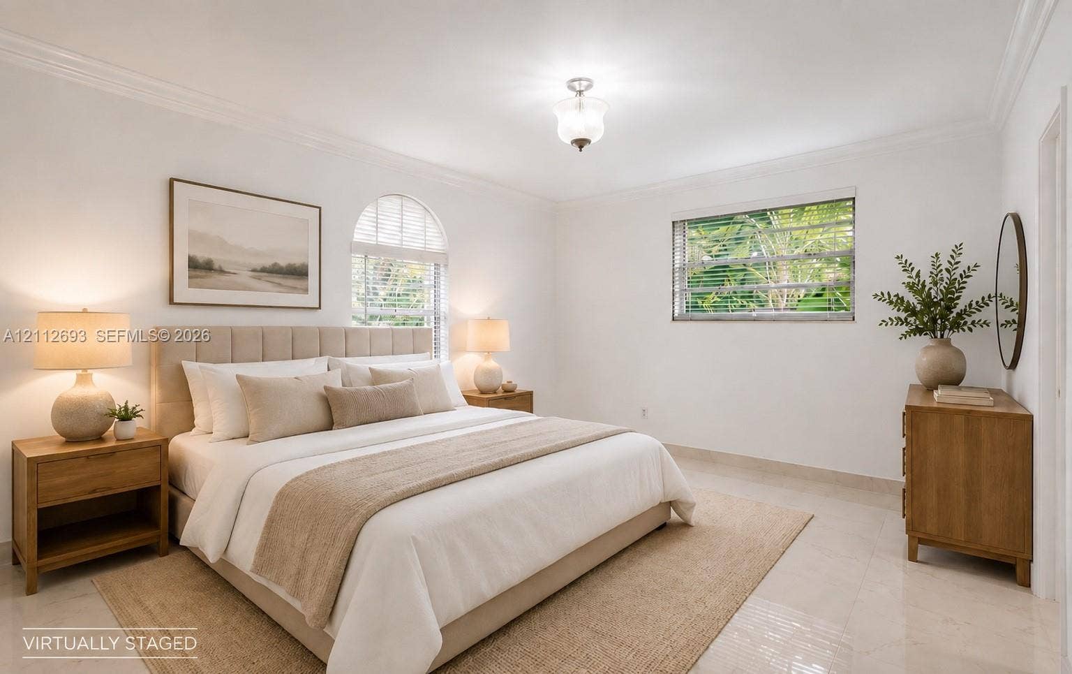 Homestead, Homestead, FL 33033 Neutral-toned tile flooring, arched window with horizontal blinds, multi-pane window, crown molding, and semi-flush mount ceiling fixture