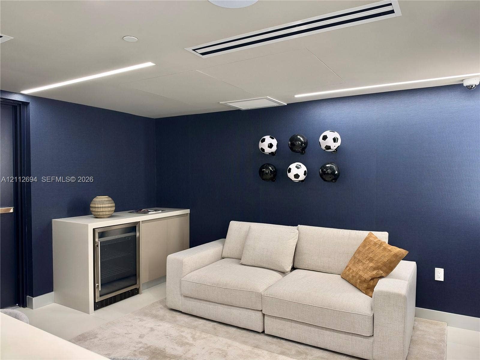 1170 E Hallandale Beach Boulevard, #503, Hallandale Beach, Hallandale Beach, FL 33009 Built-in cabinetry with integrated under-counter beverage refrigerator, recessed linear lighting, and ceiling-mounted HVAC system