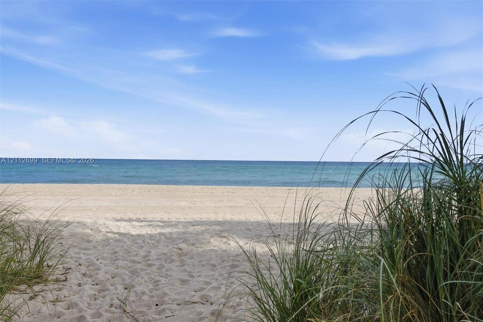 19111 Collins Avenue, #505, Sunny Isles Beach, FL 33160 Sandy beachfront featuring native grasses and direct access to the ocean