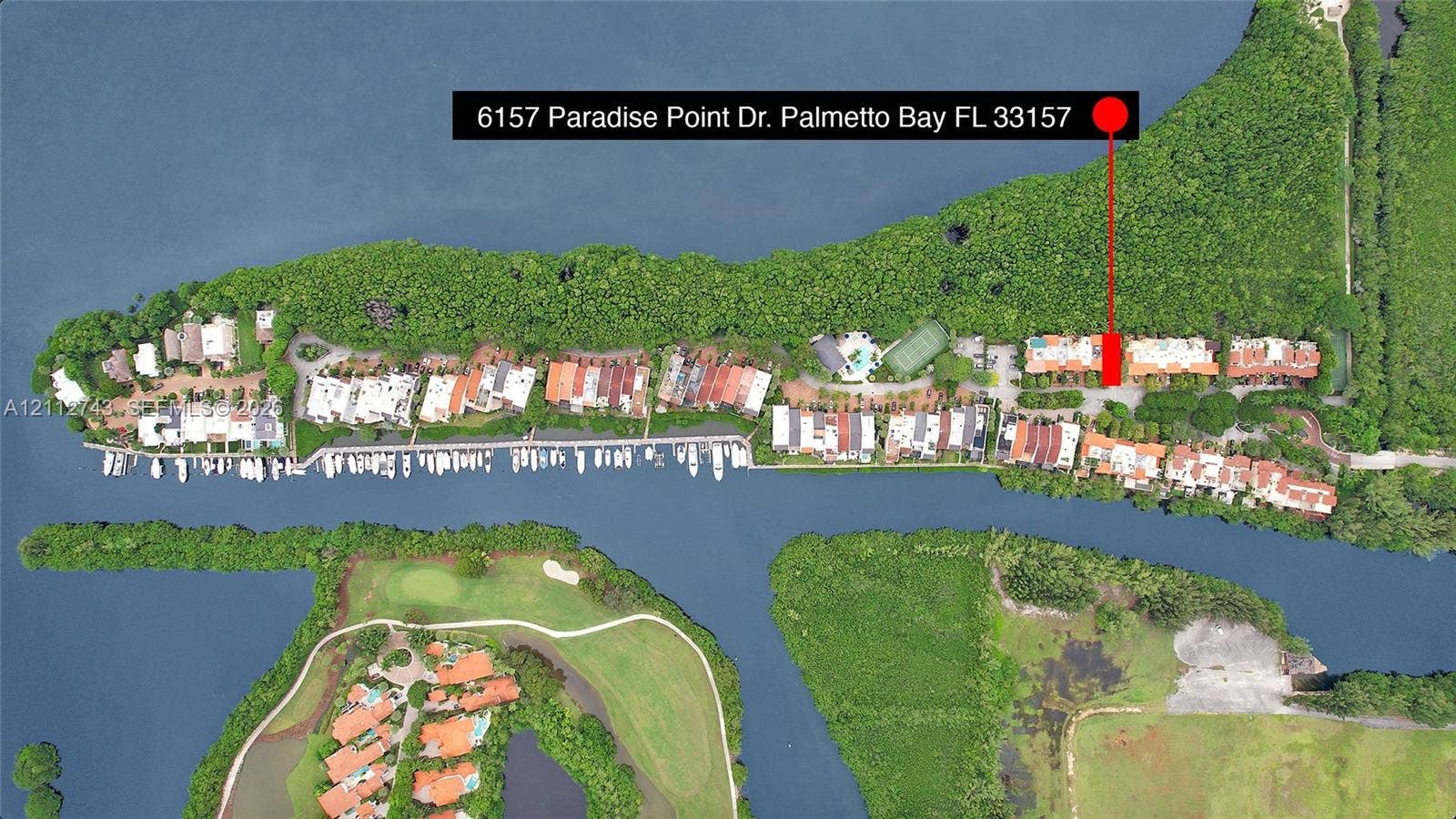6157 Paradise Point Drive, Palmetto Bay, FL 33157 Aerial perspective of waterfront property featuring direct waterway access, deep-water dockage, and dense mature vegetation