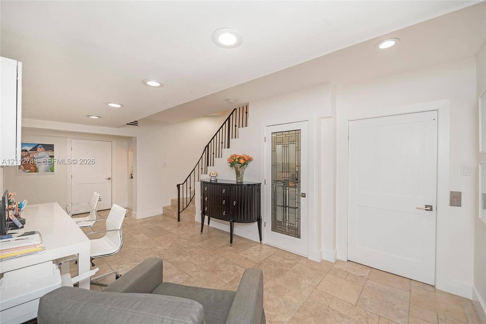 6157 Paradise Point Drive, Palmetto Bay, FL 33157 Tiled flooring, recessed lighting, staircase with metal railing, and glass-paneled interior door