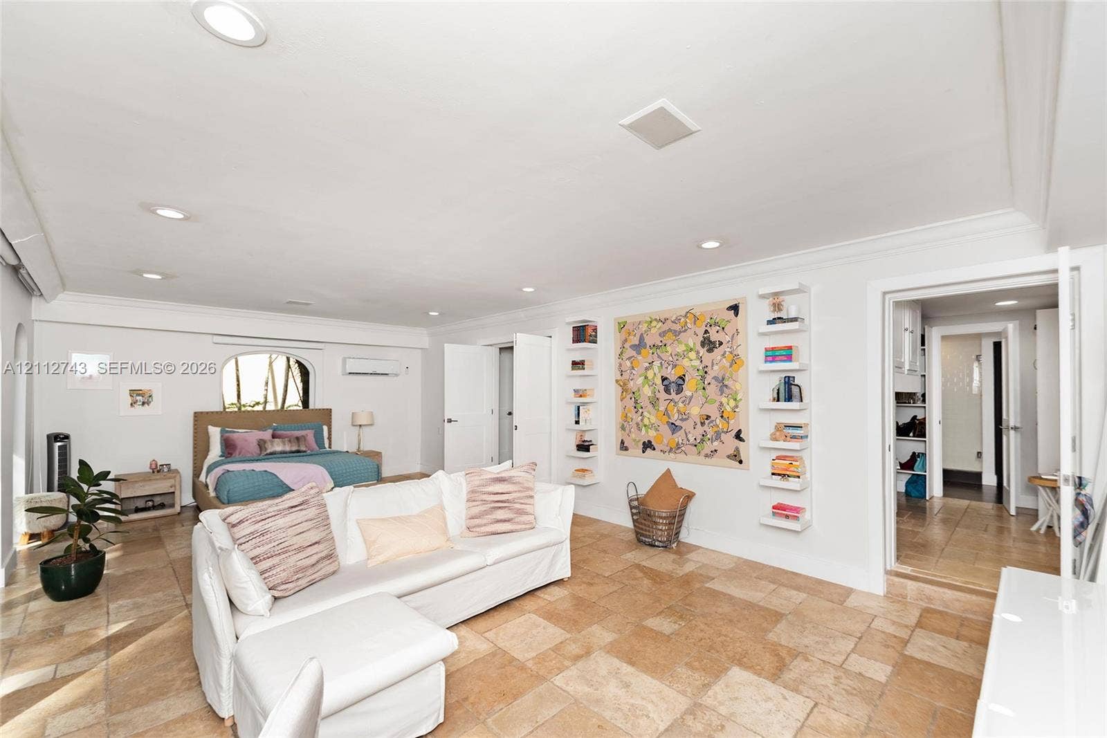 6157 Paradise Point Drive, Palmetto Bay, FL 33157 Large-format stone flooring, recessed ceiling lighting, wall-mounted floating shelves, and crown molding