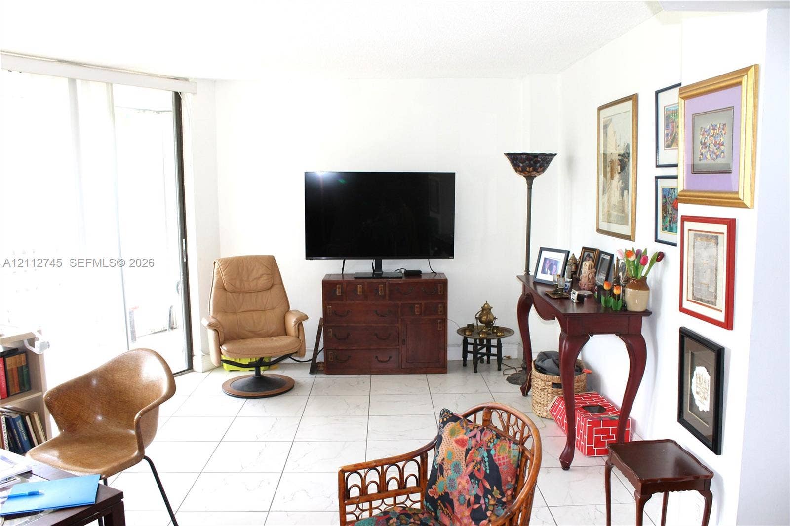 20500 W Country Club Drive, #202, Aventura, FL 33180 Interior living space featuring ceramic tile flooring and sliding glass doors