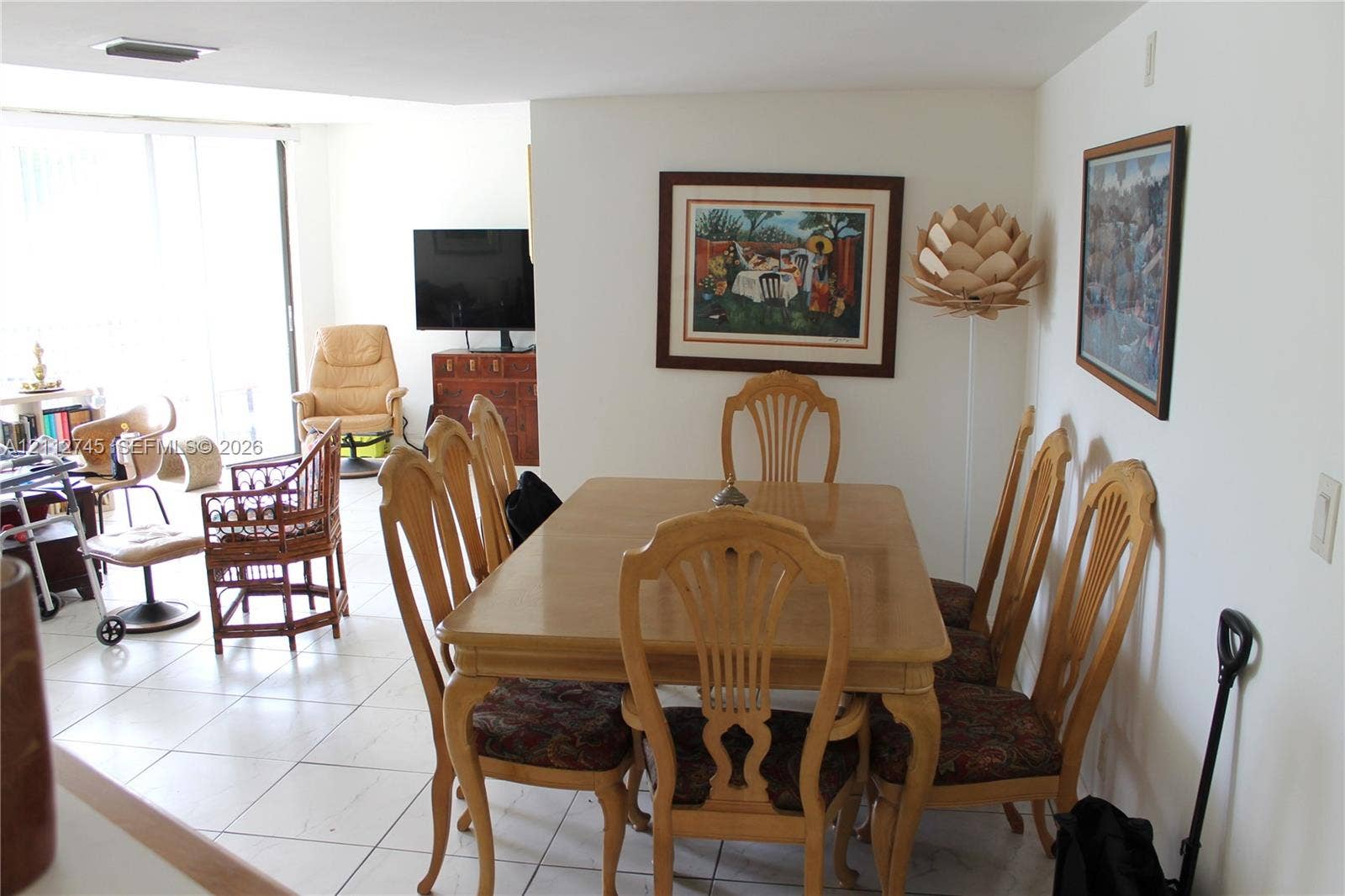 20500 W Country Club Drive, #202, Aventura, FL 33180 Neutral-toned ceramic tile flooring throughout, recessed ceiling lighting, and floor-to-ceiling glass sliding doors