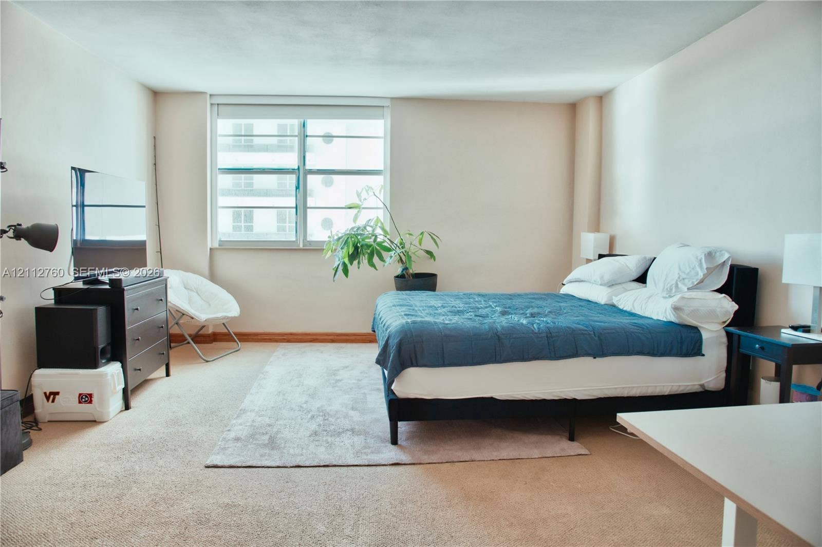 5825 Collins Avenue, #11H, Miami Beach, FL 33140 Expansive room featuring wall-to-wall carpeting and a large multi-pane window with natural lighting