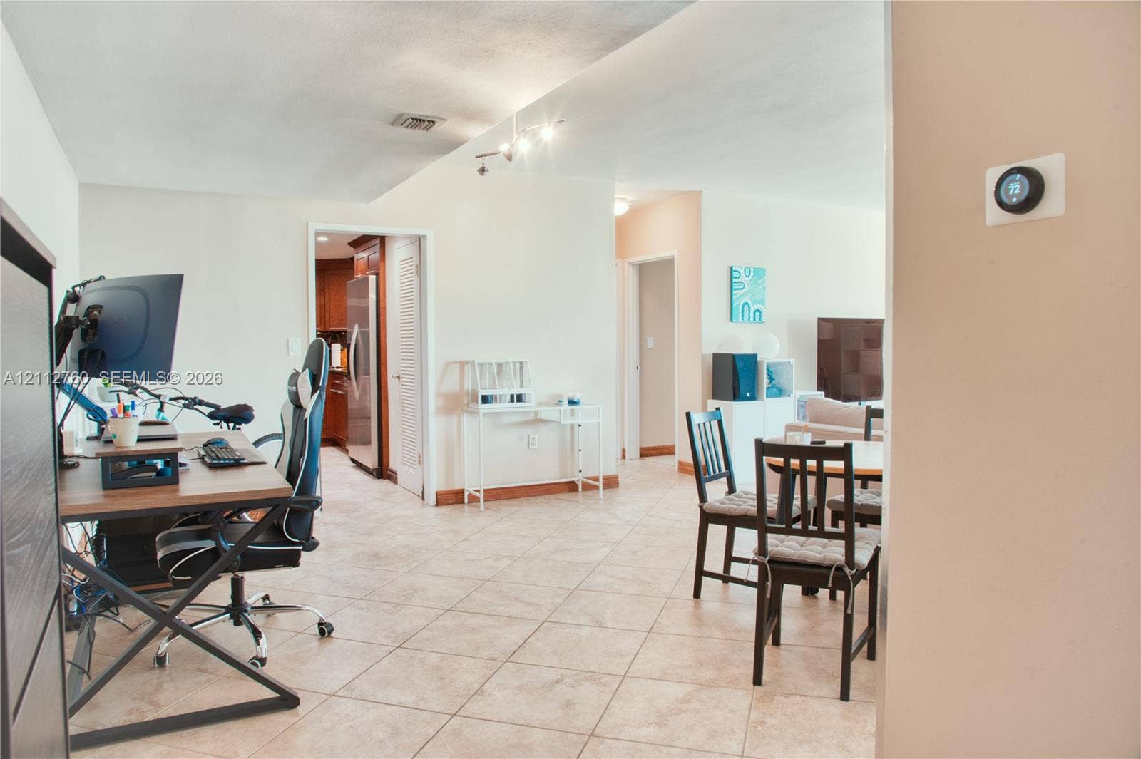 5825 Collins Avenue, #11H, Miami Beach, FL 33140 Tile flooring, multi-directional track lighting, and a wall-mounted programmable smart thermostat