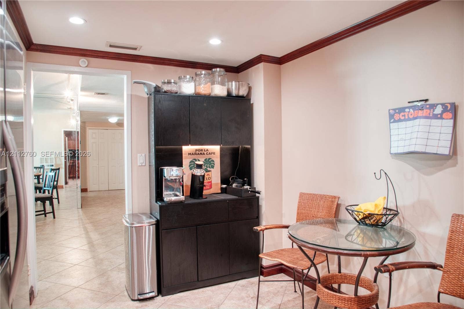 5825 Collins Avenue, #11H, Miami Beach, FL 33140 Built-in black cabinetry with integrated under-cabinet lighting and tiled flooring
