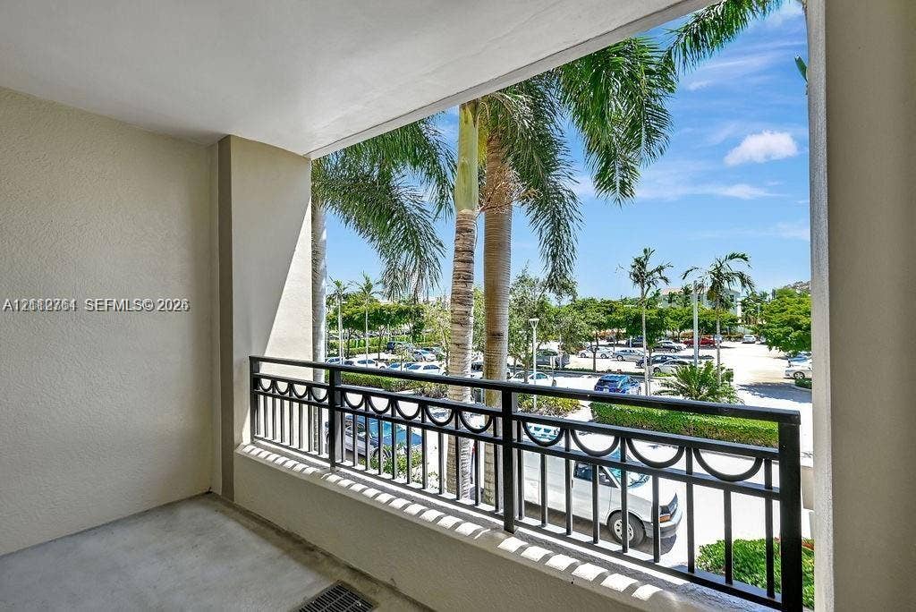 550 Okeechobee Boulevard, #224, West Palm Beach, West Palm Beach, FL 33401 Covered balcony featuring concrete flooring and a decorative black metal railing