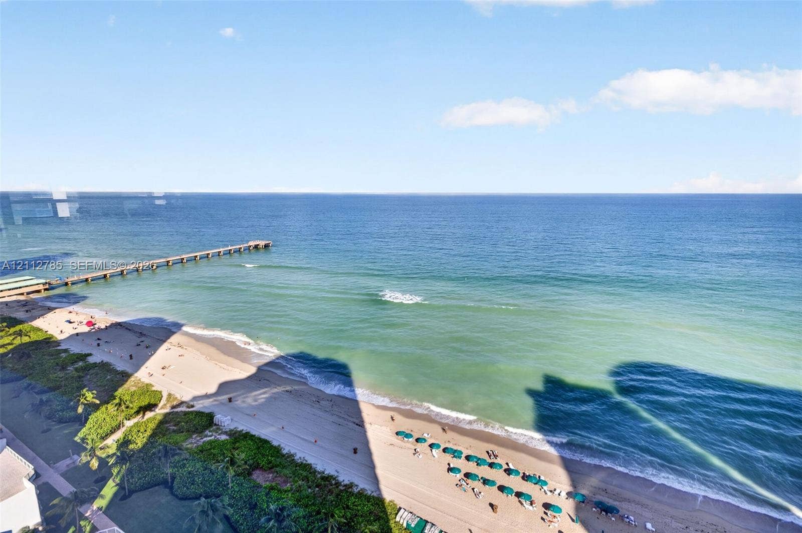 16425 Collins Avenue, #2016, Sunny Isles Beach, FL 33160 Elevated oceanfront perspective featuring expansive water horizons, direct sandy coastline access, and a structural pier
