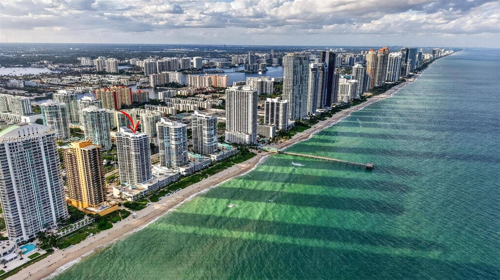 16425 Collins Avenue, #2016, Sunny Isles Beach, FL 33160 Aerial perspective featuring oceanfront high-rise building with direct proximity to the coastline