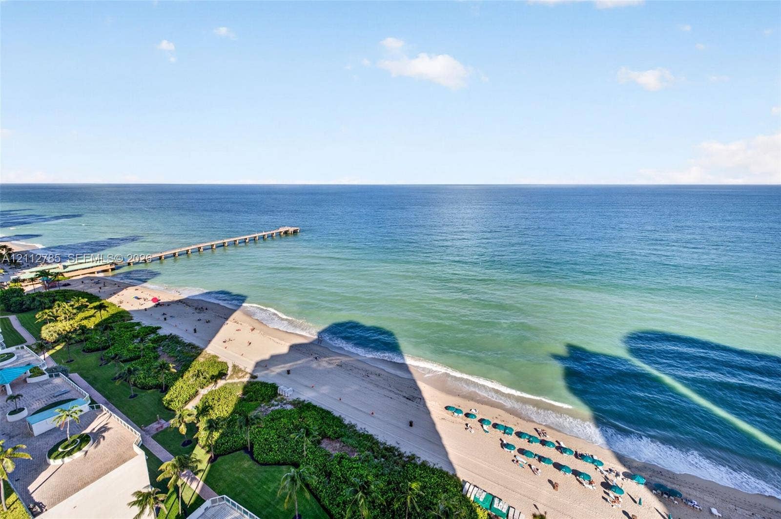 16425 Collins Avenue, #2016, Sunny Isles Beach, FL 33160 Panoramic oceanfront exposure featuring an expansive coastal horizon, sandy beach shoreline, and a prominent pier structure