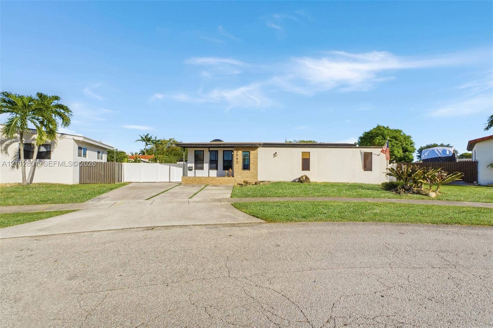 3241 SW 84th Court, Miami, FL 33155 Single-story exterior featuring light-toned masonry, concrete driveway, and established landscaping