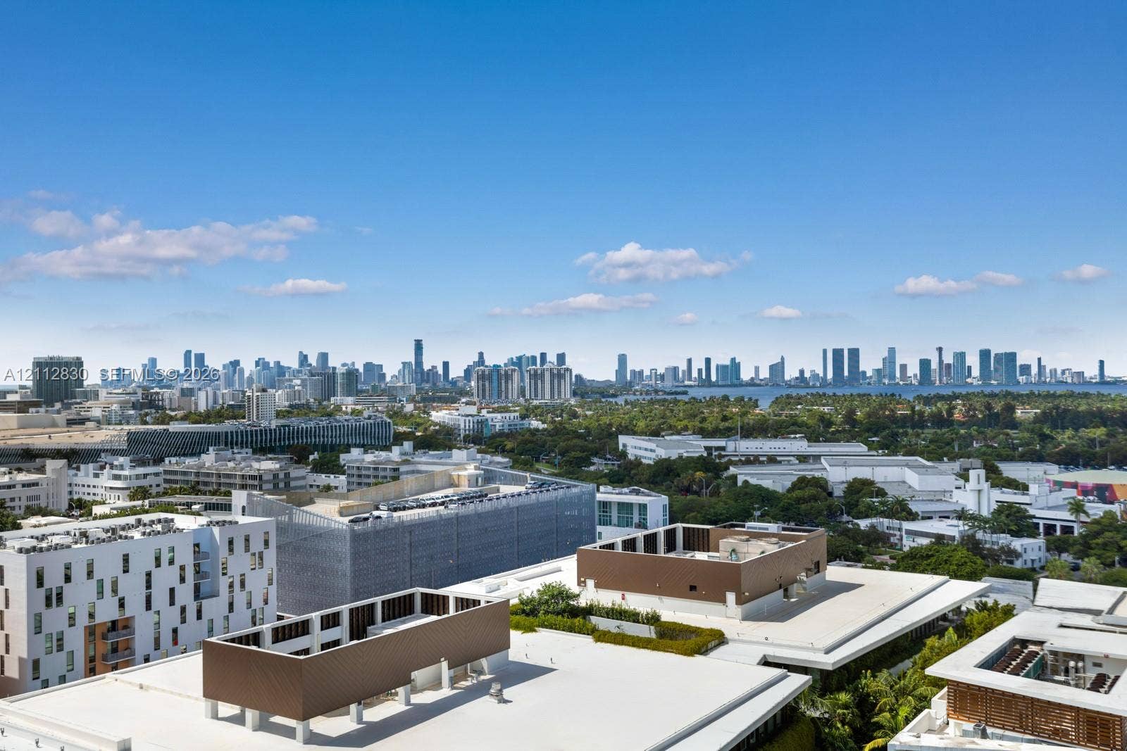 Elevated perspective showcasing an expansive urban skyline and coastal horizon