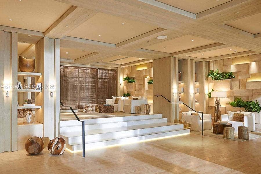 Multi-level interior space featuring coffered ceilings, light-toned wood paneling, recessed lighting, integrated wall shelving, and a tiered staircase with metal handrails