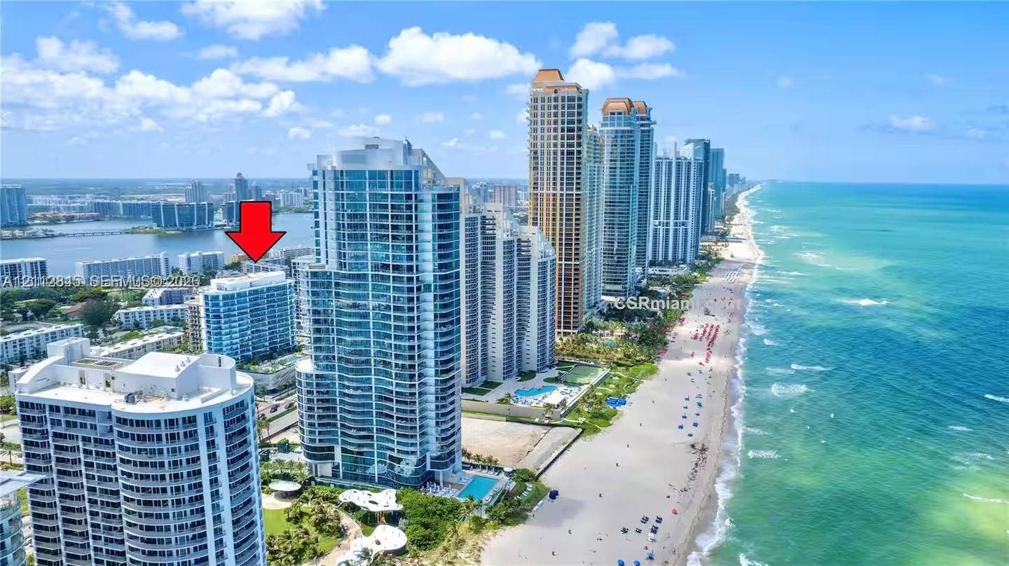 17550 Collins Avenue, #1202, Sunny Isles Beach, Sunny Isles Beach, FL 33160 Aerial perspective featuring coastal high-rise structures, direct oceanfront proximity, and sandy beach access