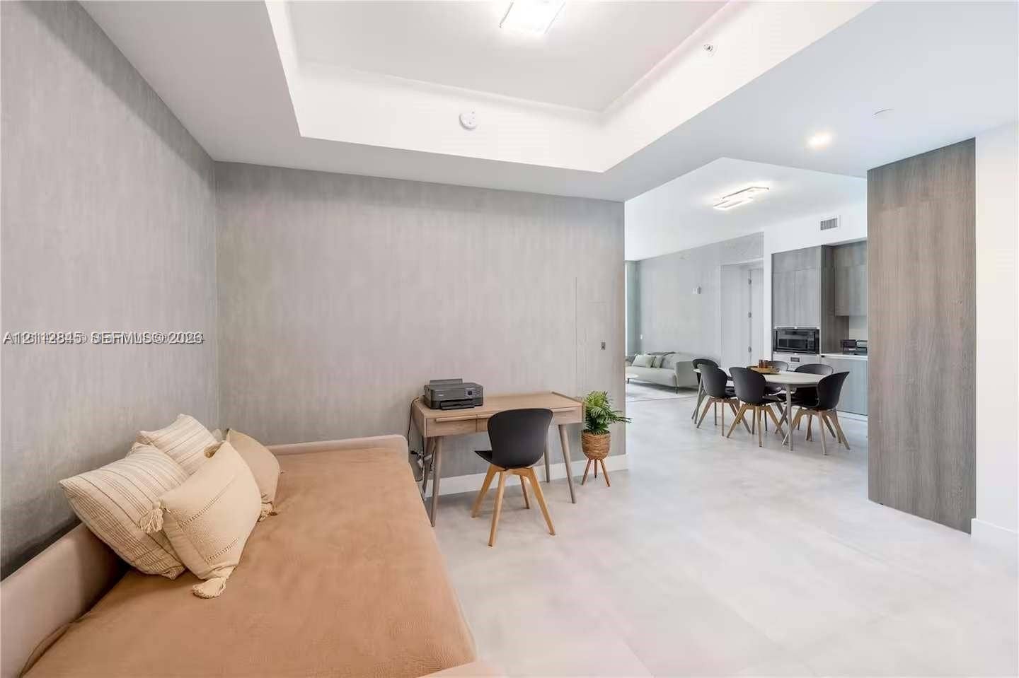 17550 Collins Avenue, #1202, Sunny Isles Beach, Sunny Isles Beach, FL 33160 Tray ceiling with recessed lighting, large-format tile flooring, and textured wall finish
