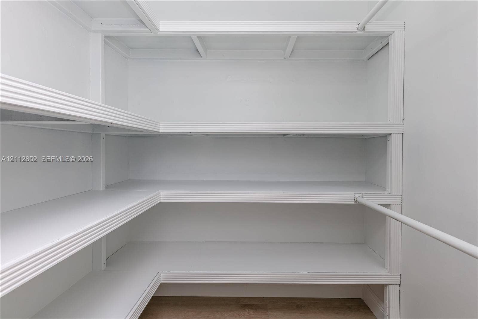 5741 Riverside Drive, #205A5, Coral Springs, Coral Springs, FL 33067 Built-in wrap-around shelving with tiered levels and integrated hanging rods